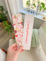 This is the bookmark showing the front with valentine day designs and the back that says pretty girls read. 